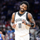 Kyrie Irving #11 of the Brooklyn Nets reacts after scoring against the Orlando Magic in the second half at Amway Center on March 15, 2022 in Orlando, Florida.